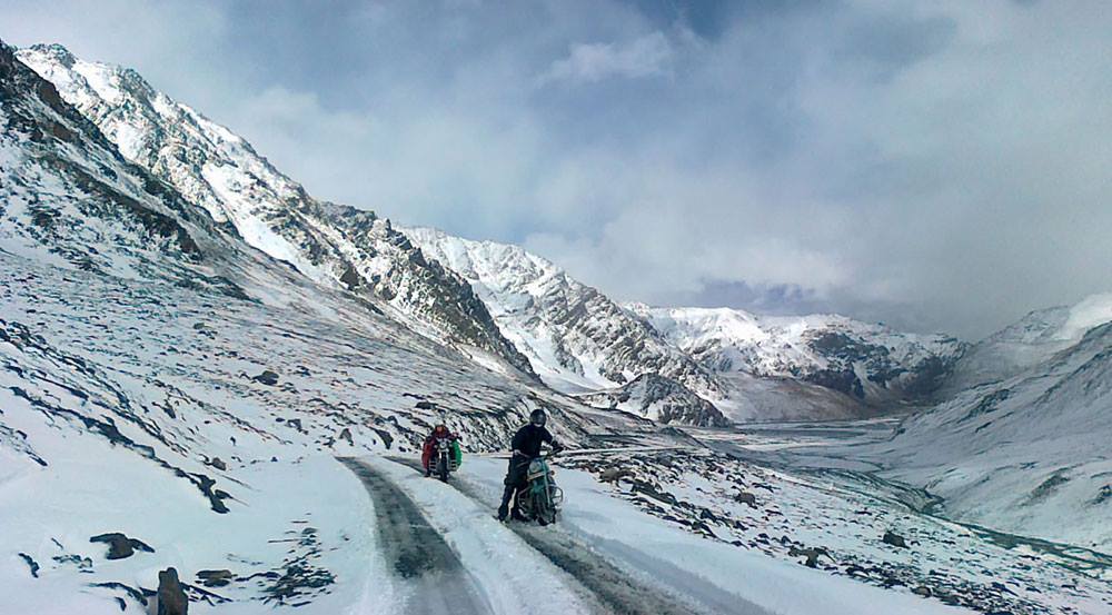 A magical season in Ladakh characterized by pristine snow-covered landscapes, frozen rivers and lakes, and clear blue skies. It offers a unique experience of serene beauty, winter sports like ice skating and skiing, and a chance to witness traditional Ladakhi winter festivals amidst the snow-clad mountains of the Himalayas.